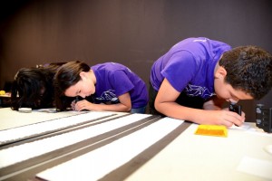 boy and girl with scope
